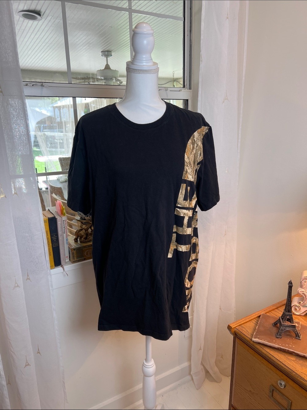 The North Face Black Tee with Gold Side Logo size XL.